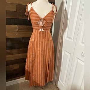Storia orange midi with ties and cutouts